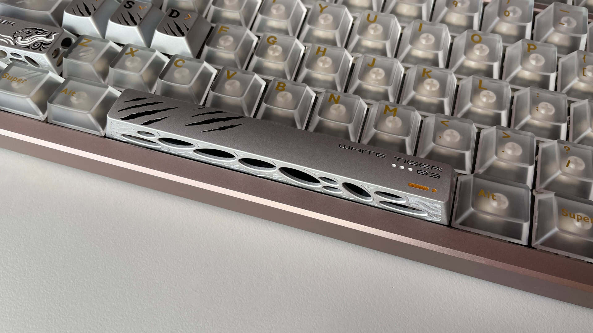 The aluminum Spacebar installed on an ATK × QK Hex80 keyboard, showing its engraved surface and metal construction.