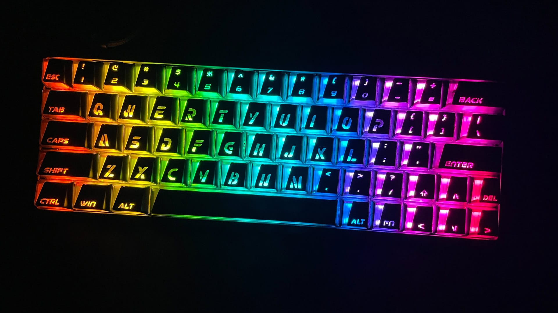 The XVX Trooper63 HE glowing with RGB backlighting in a dark environment.