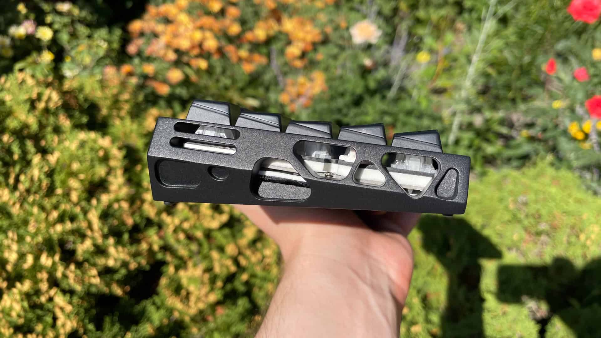 Side view of the XVX Trooper63 HE showing its sculpted profile and strap mounting point.