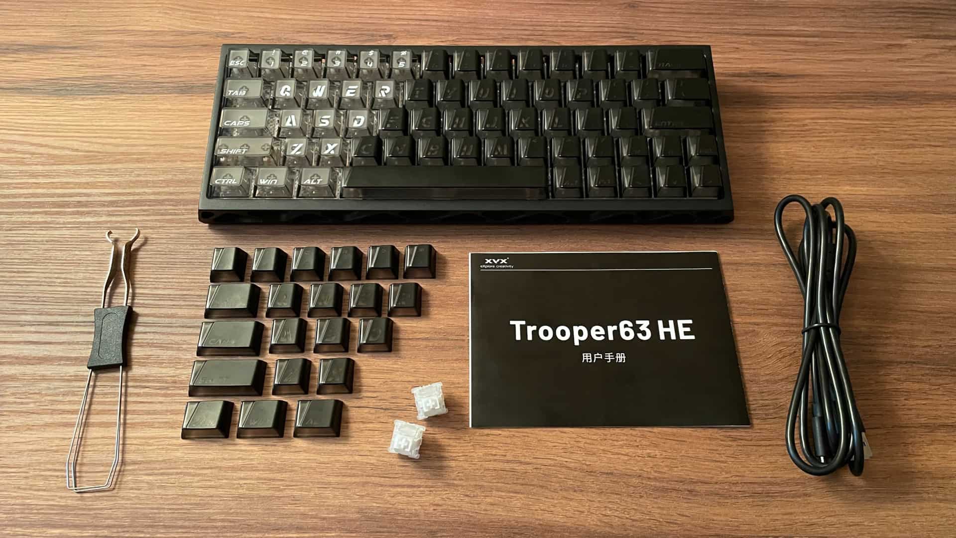 The XVX Trooper63 HE keyboard and all included accessories laid out together.