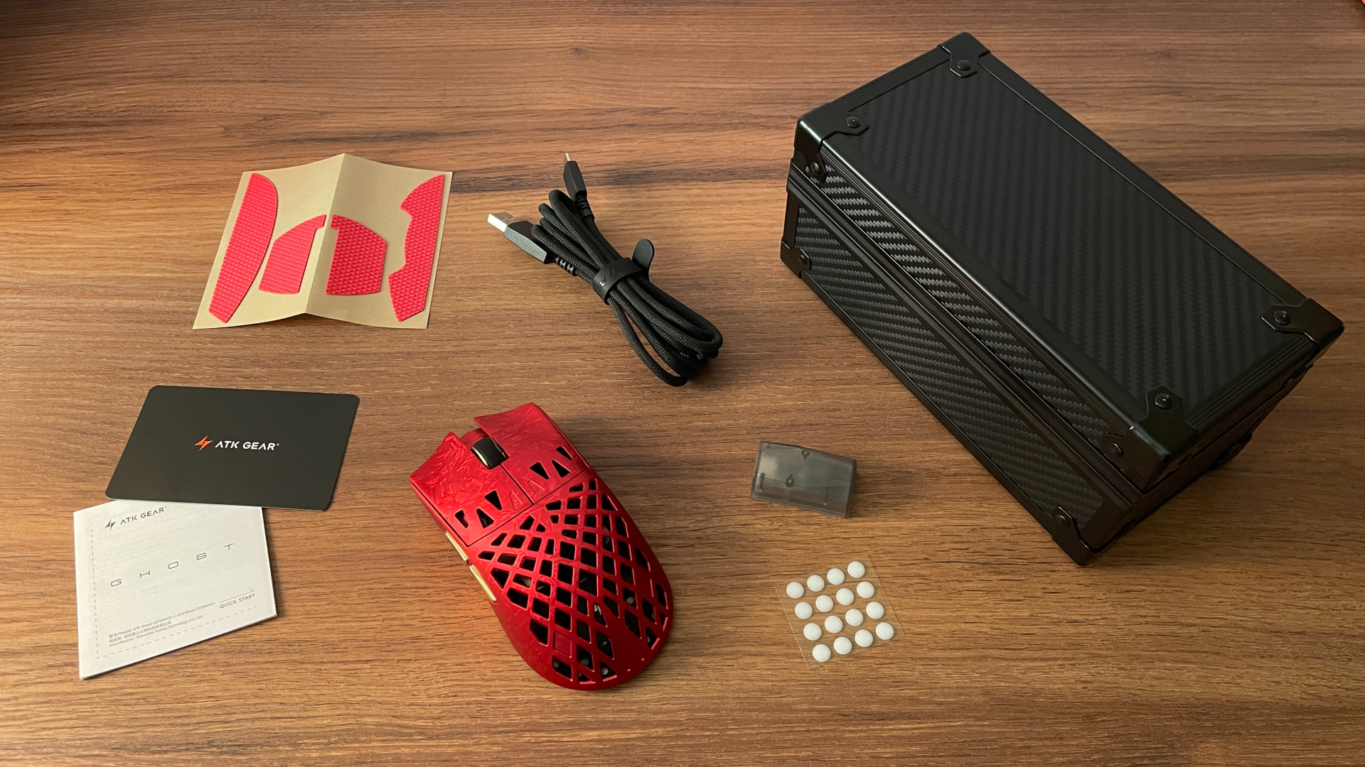 ATK Ghost Review – A Distinctive Take on the Lightweight Carbon Fiber Gaming Mouse 6 ATK Ghost gaming mouse shown with its included accessories and storage case.
