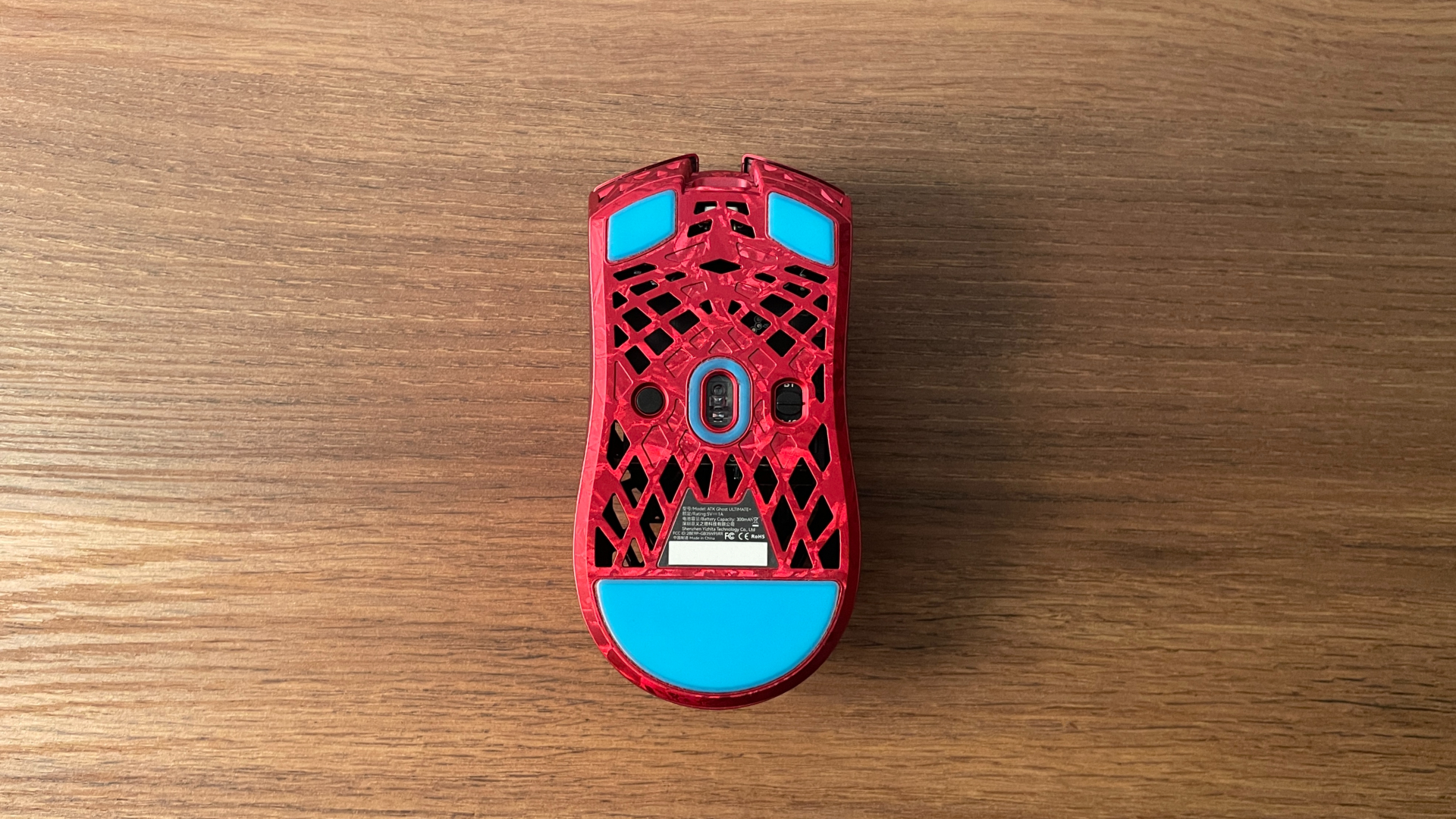 ATK Ghost Review – A Distinctive Take on the Lightweight Carbon Fiber Gaming Mouse 12 Bottom view of the ATK Ghost gaming mouse showing the sensor, controls, and PTFE skates.