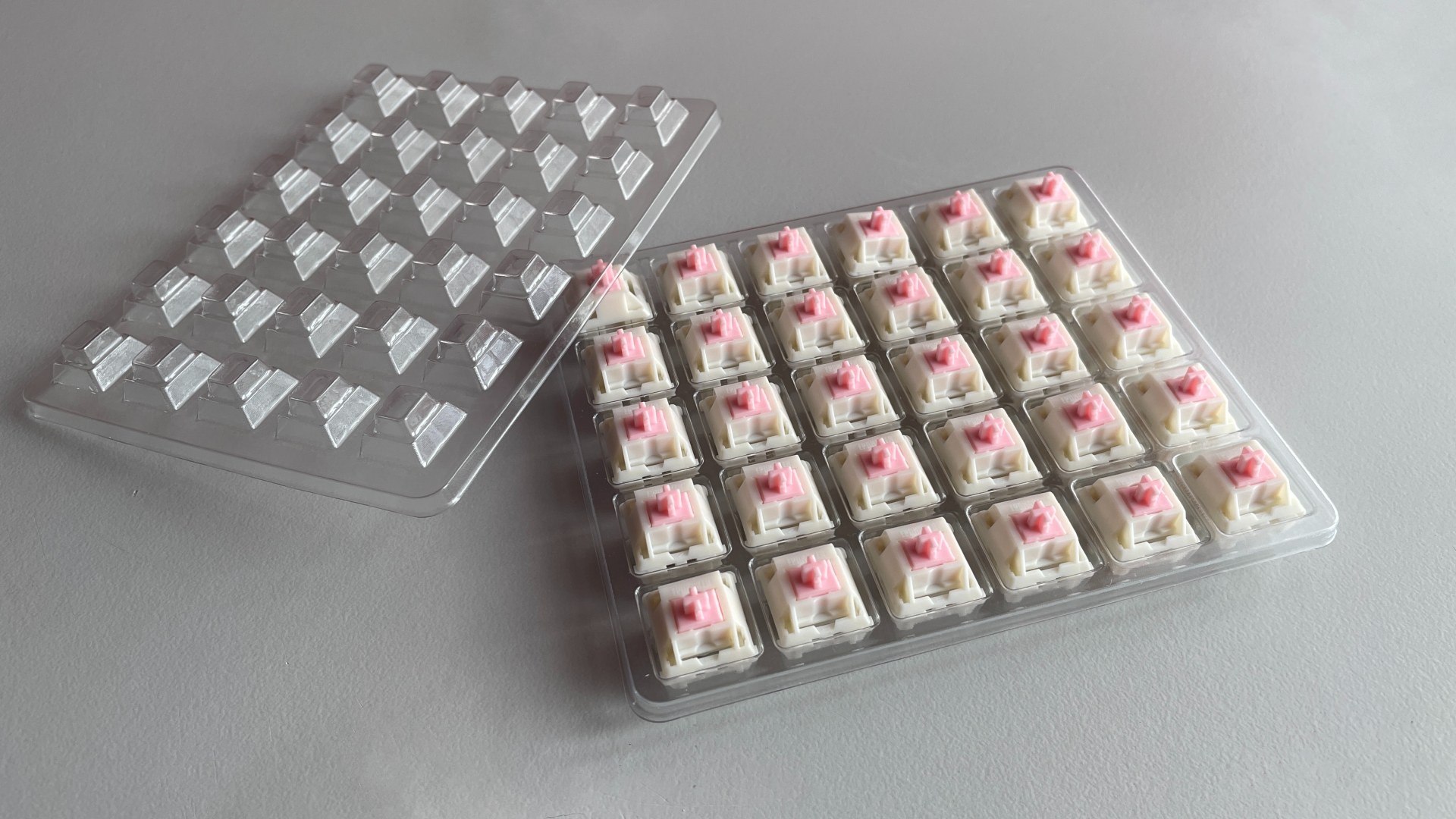 Epomaker Roseveil mechanical keyboard switches arranged in their plastic tray.