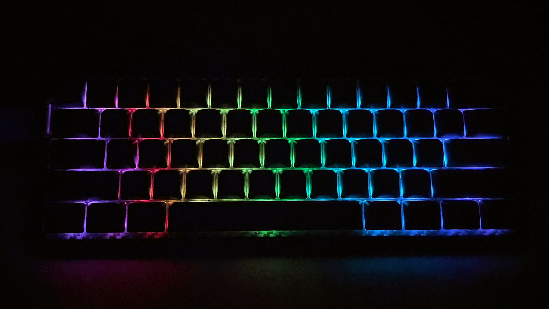 Epomaker Carbon60 Review – A Portable Low-Profile Keyboard with a Carbon Fiber Case 12 Epomaker Carbon60 low-profile mechanical keyboard with its backlighting illuminated in the dark.
