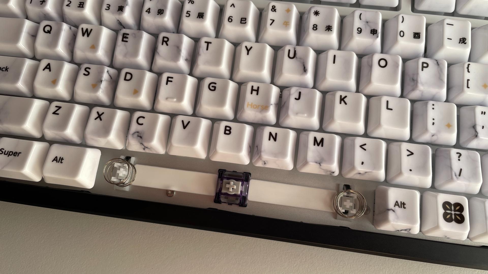 XVX Ceramic Keycaps Review: Year of the Horse Keycap Set 21 Two additional springs installed beneath the spacebar to support the weight of the ceramic keycap.