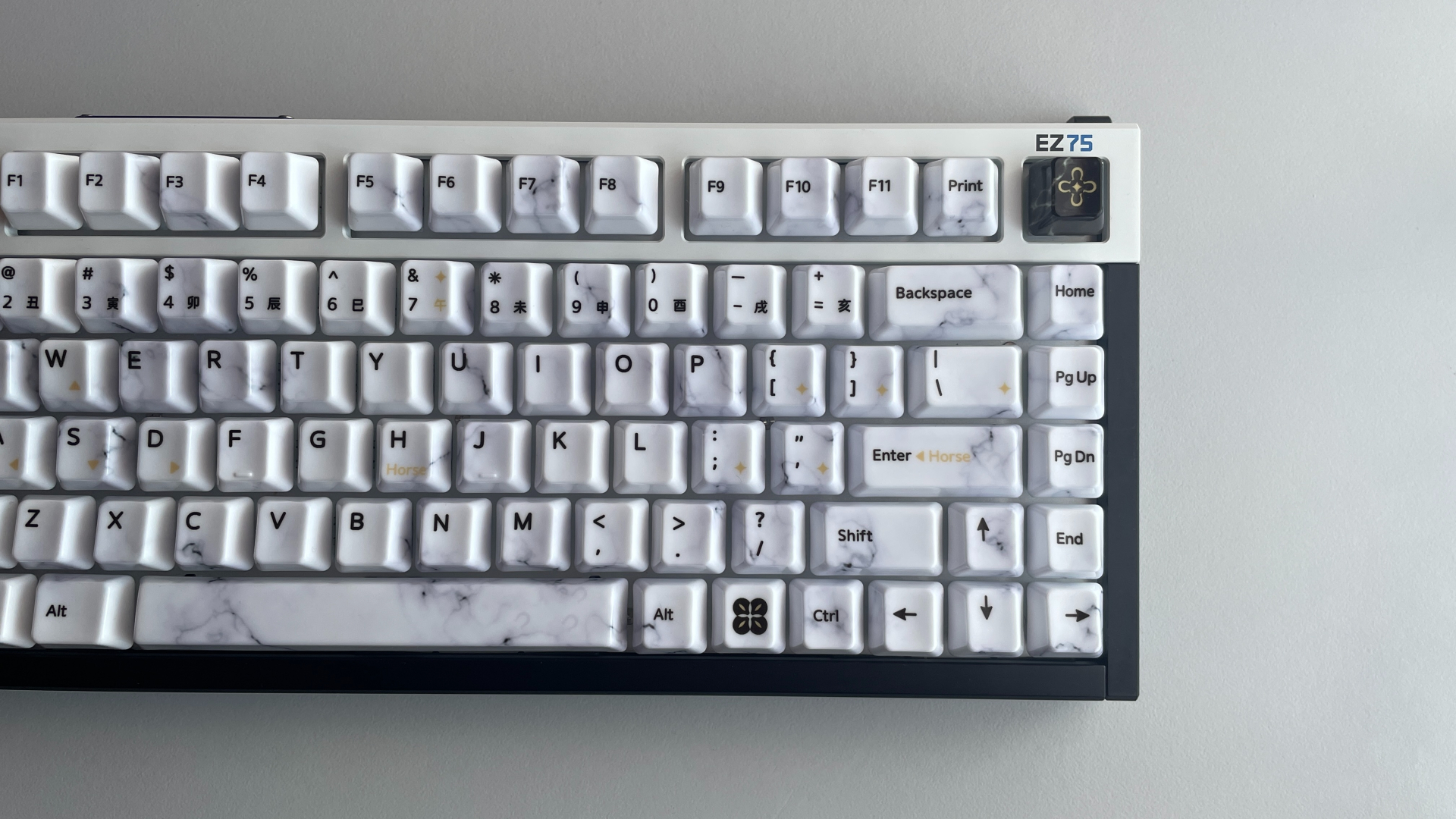 XVX Ceramic Keycaps Review: Year of the Horse Keycap Set 23 Keyboard fitted with XVX Year of the Horse ceramic keycaps, showing their marble-like design.