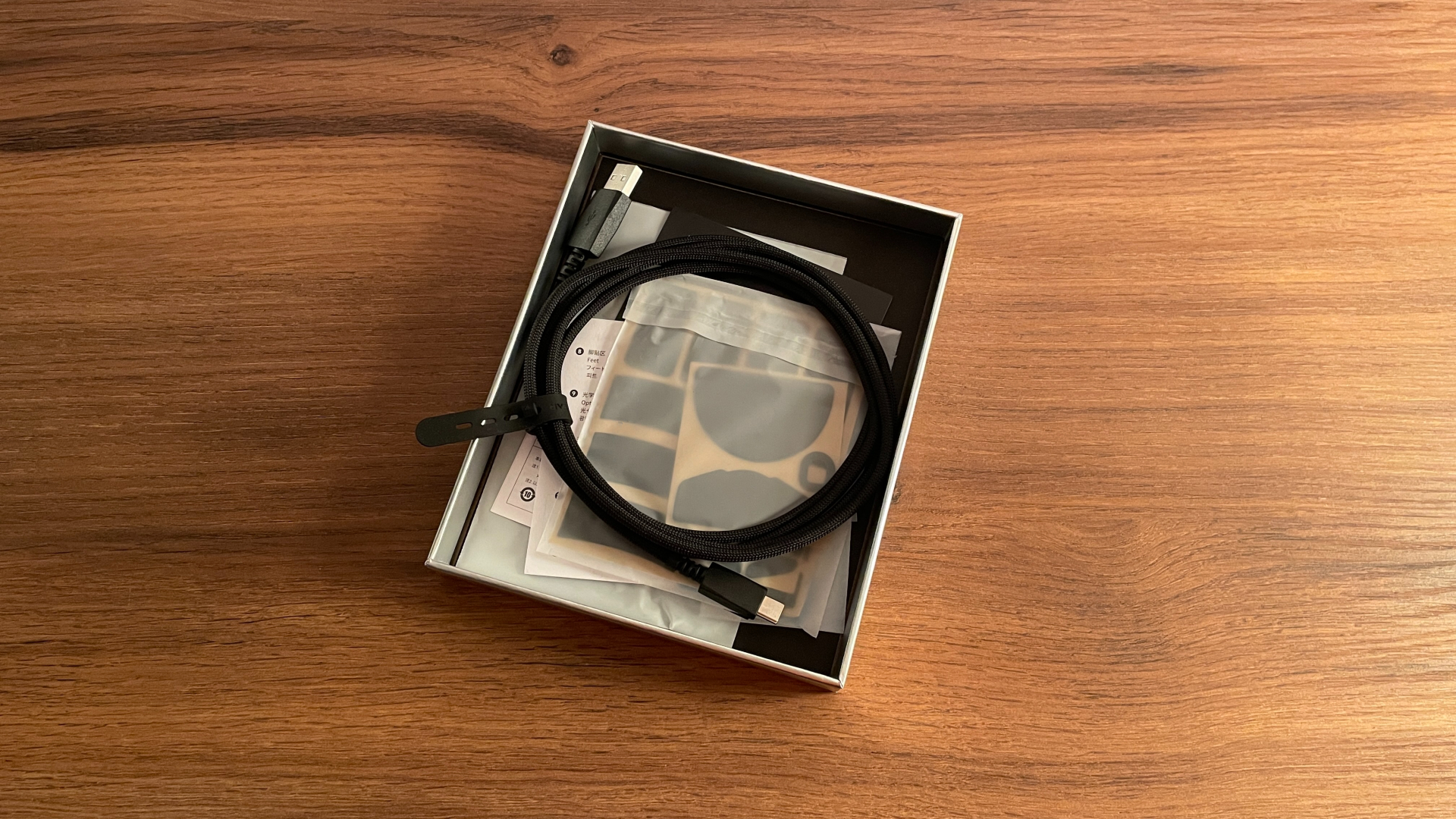The ATK Phantom accessories arranged in the lower compartment of the box.