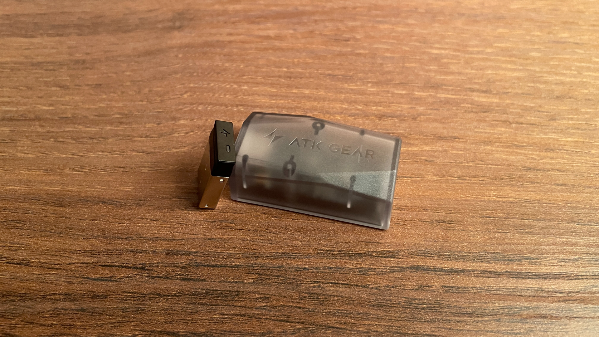The ATK Nano 8K and ATK Gem 8K dongles placed side by side.