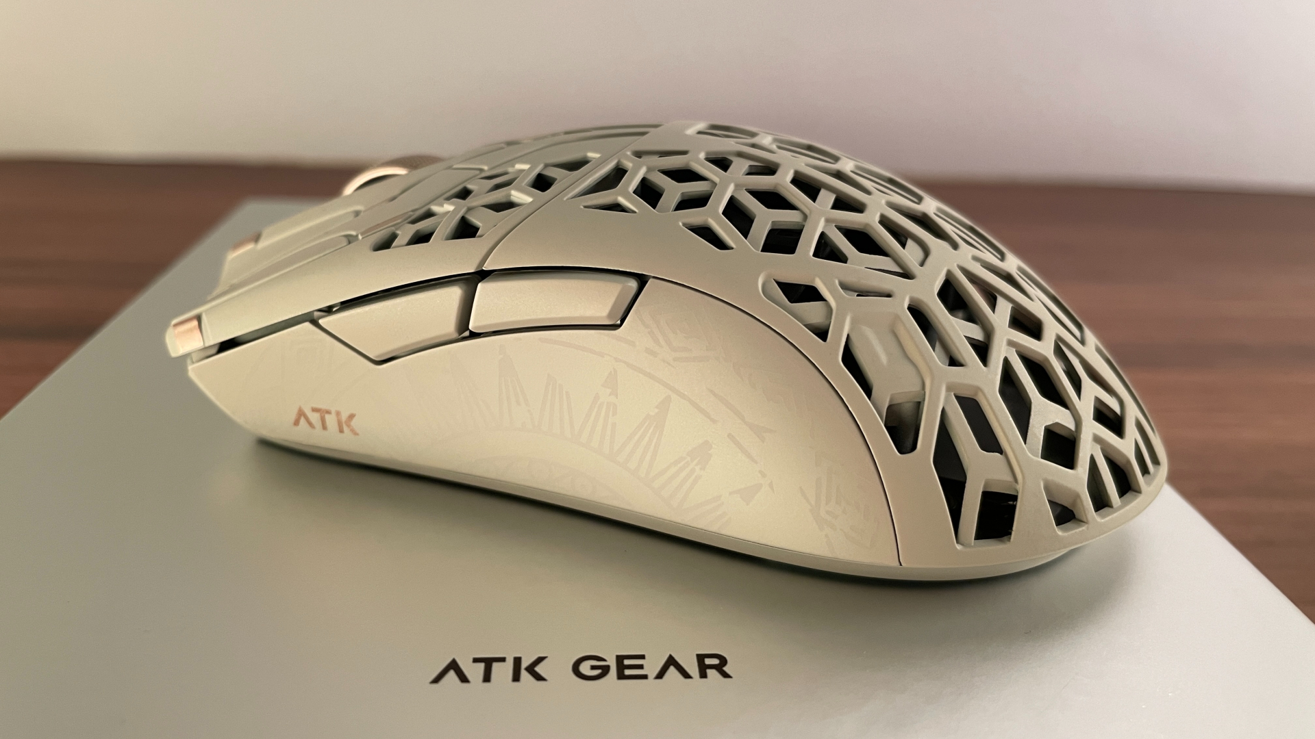 Close-up of the ATK Phantom gaming mouse, focusing on the side buttons.