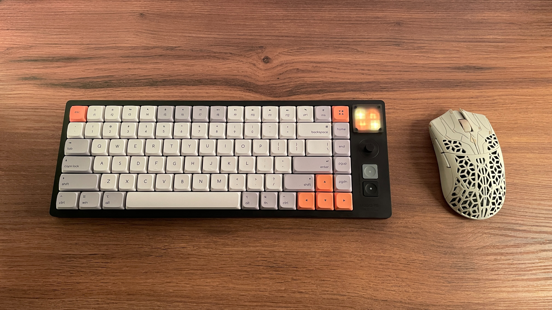The ATK Phantom gaming mouse on a desk next to the ATK Yogo 75 Pro keyboard.