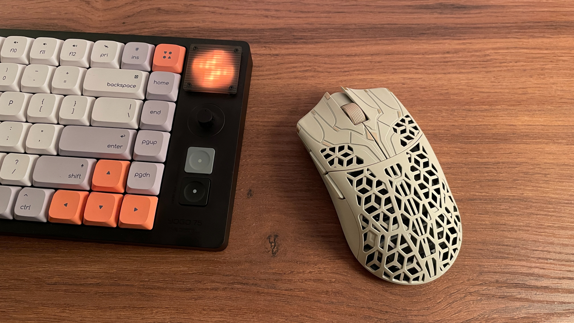 The ATK Phantom gaming mouse next to the ATK Yogo 75 Pro keyboard fitted with ATK Retro DSA PBT keycaps.