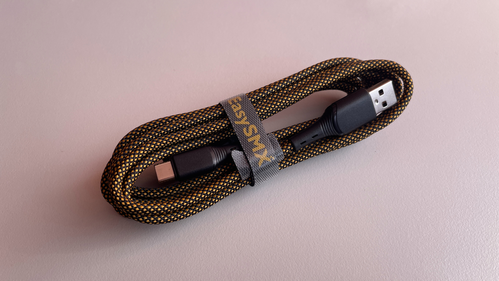 EasySMX Dune 8K Review – A Close Encounter with a One-of-a-Kind Controller 7 Black-and-gold braided USB-C to USB-A cable included with the EasySMX Dune 8K.
