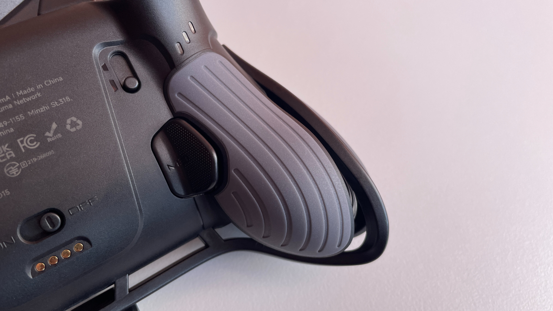 EasySMX Dune 8K Review – A Close Encounter with a One-of-a-Kind Controller 16 Striped texture on the rear grip of the EasySMX Dune 8K controller.