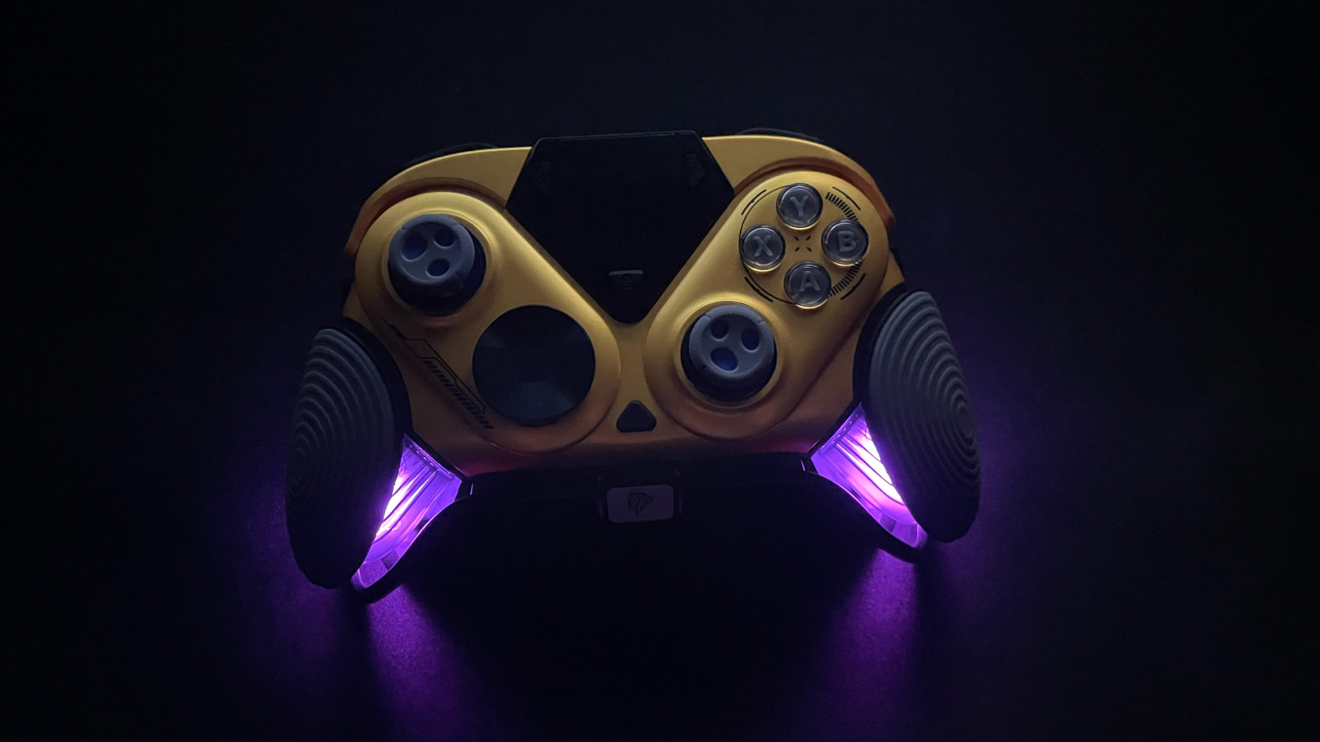 EasySMX Dune 8K Review – A Close Encounter with a One-of-a-Kind Controller 25 EasySMX Dune 8K controller in the dark with the RGB lighting inside its grips switched on.