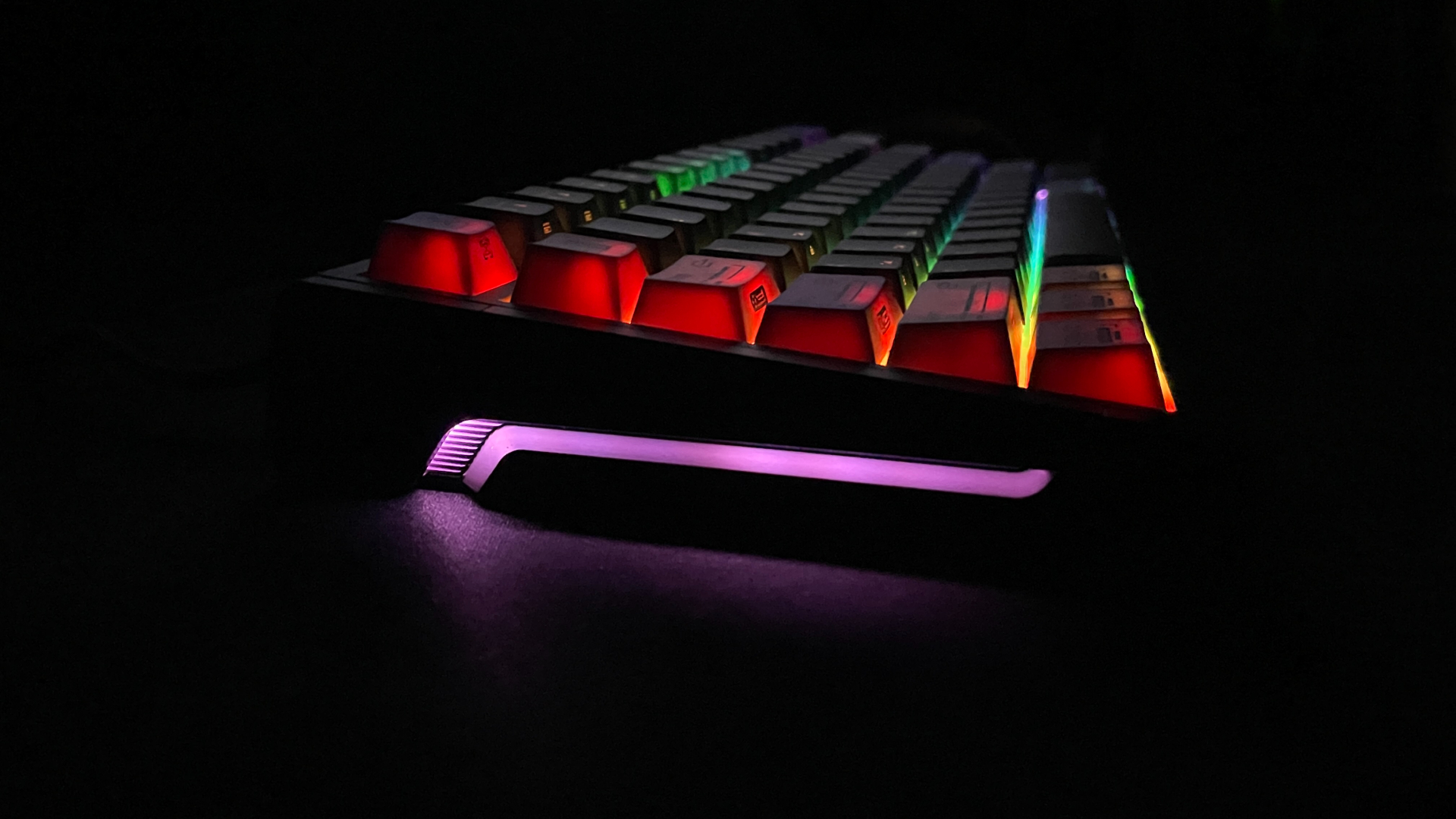 ATK RS7 V2 Ultra Review – A 75% Hall Effect Keyboard With A Twist 13 The ATK RS7 V2 Ultra keyboard in the dark, showing the RGB lighting along its side.