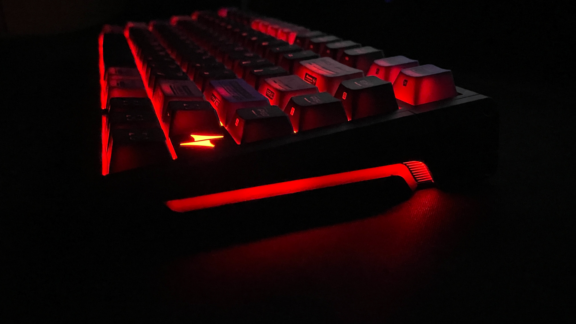 ATK RS7 V2 Ultra Review – A 75% Hall Effect Keyboard With A Twist 35 The ATK RS7 V2 Ultra keyboard glowing red across all three RGB lighting zones.