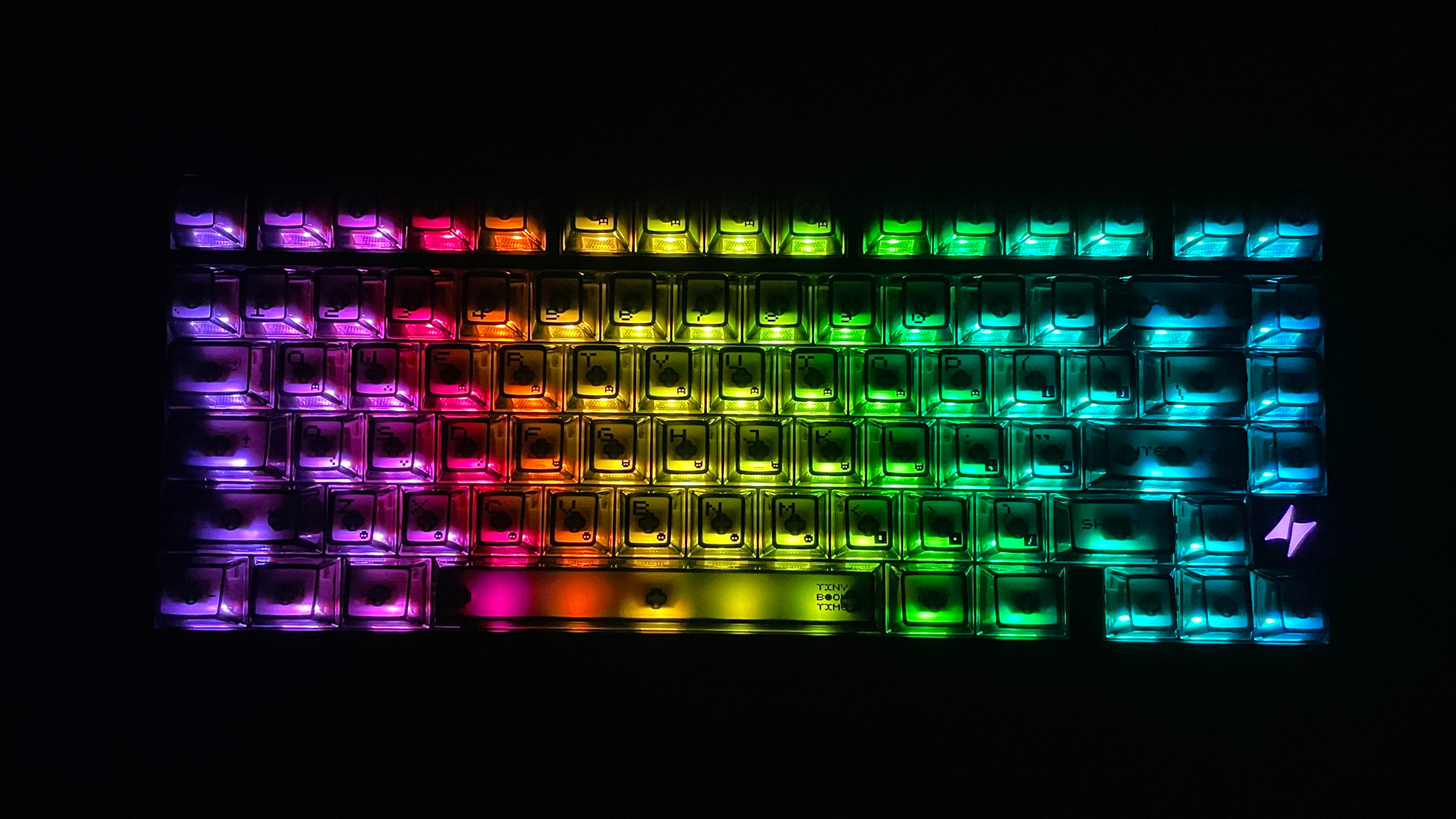 ATK RS7 V2 Ultra Review – A 75% Hall Effect Keyboard With A Twist 16 The ATK RS7 V2 Ultra keyboard in the dark, with RGB lighting shining through the transparent sides of the PC keycaps.